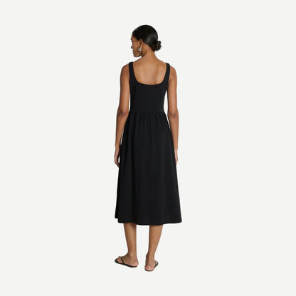 Jet black Nation LTD Laurel midi dress with a fitted silhouette, featuring a scoop neckline and sleeveless design.
