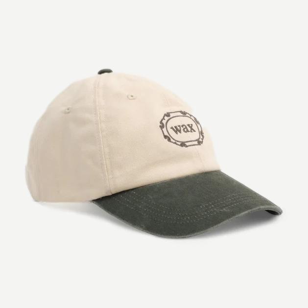 Wax London sports cap in ecru and khaki cotton, casual hat with curved brim and adjustable strap.