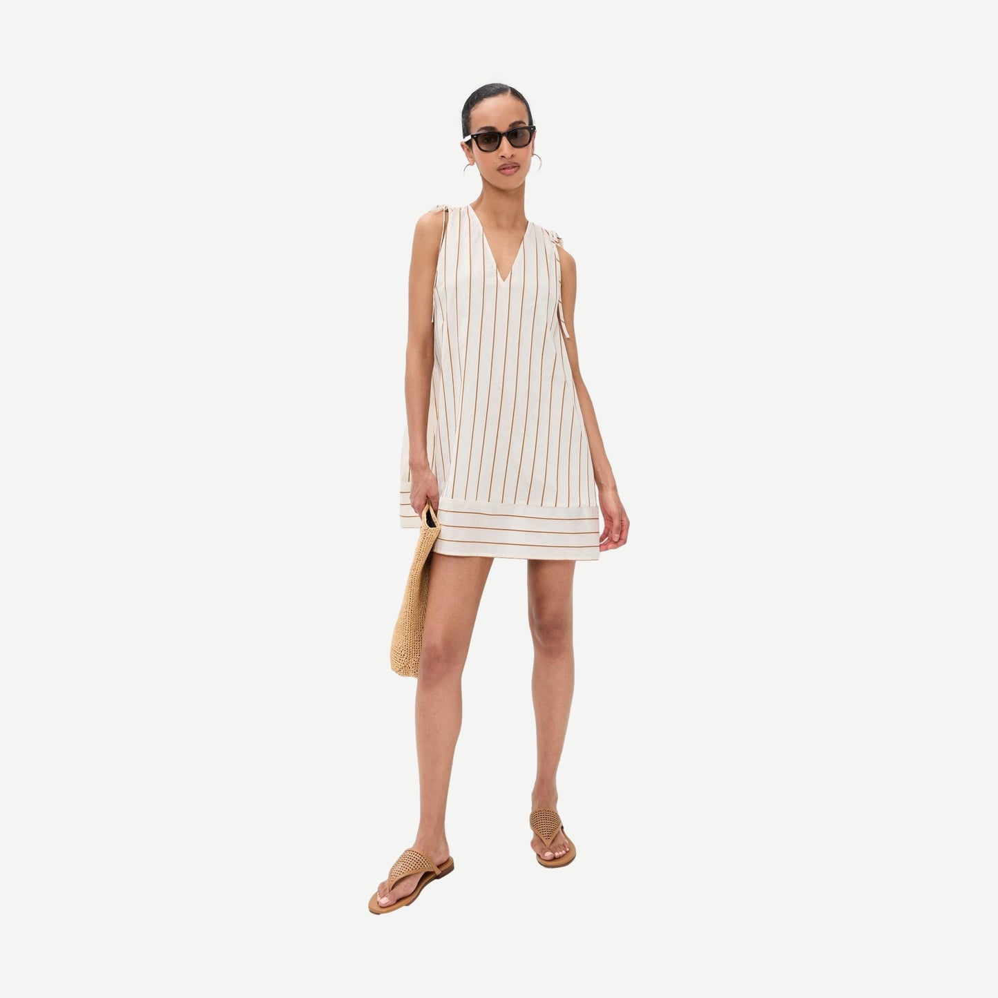 Staud Elena Dress in Solana Stripe featuring a stylish, sleeveless design with vibrant striped pattern and lightweight fabric.