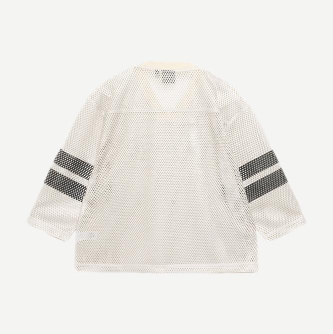 Tan Stussy Trucker Team Jersey shirt with logo embroidery and classic trucker style, displayed on a plain background.