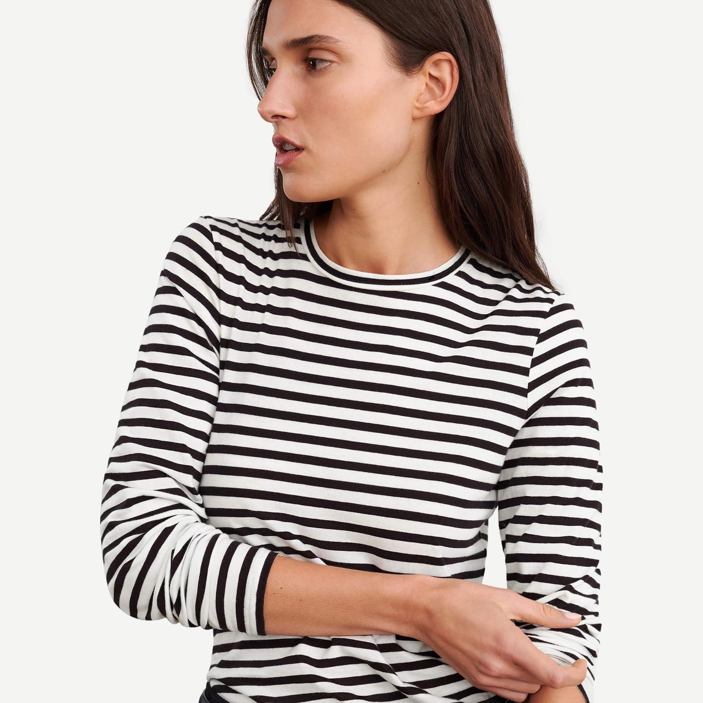 Nili Lotan Susana long sleeve T-shirt in black and ivory stripe, with a fitted design and classic crew neckline.