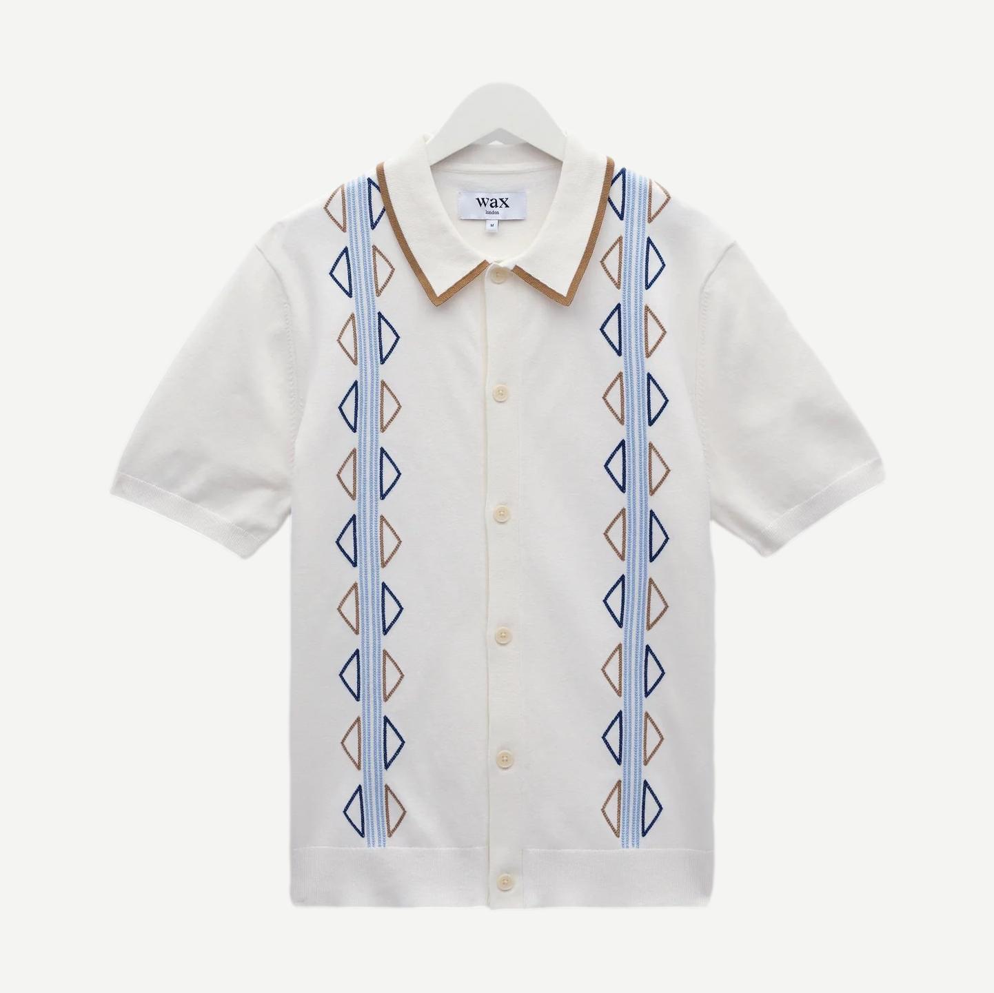 Wax London Tellaro SS shirt in ecru with blue retro embroidery, featuring a casual fit and detailed stitched design.